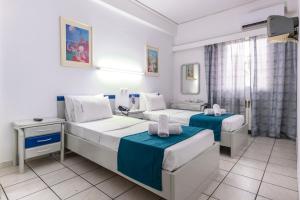 Postel nebo postele na pokoji v ubytování ROY Hotel
