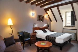 מיטה או מיטות בחדר ב-Logis Hotel Oasis