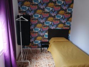 A bed or beds in a room at Alcaravaneras Hostel