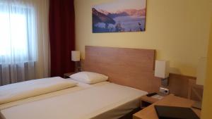 Postel nebo postele na pokoji v ubytování Alpen-Hotel Seimler