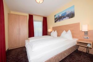Postel nebo postele na pokoji v ubytování Alpen-Hotel Seimler