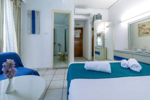 Postel nebo postele na pokoji v ubytování ROY Hotel