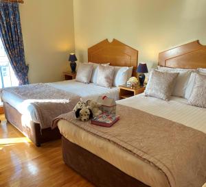 Letto o letti in una camera di O'Shea's Hotel