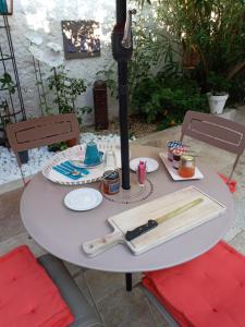 a white table with utensils on top of it at Casa Ammirati Apartments in Marseille