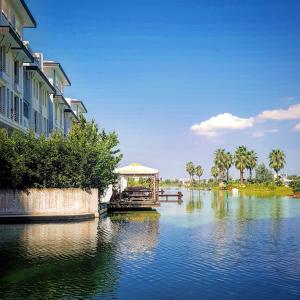 a boat on a river with a gazebo on it at Hallmark Bursa in Bursa