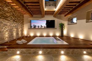 The swimming pool at or close to Mastrojanni Relais