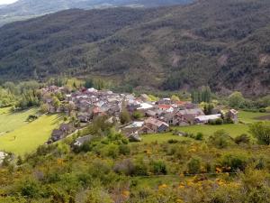 an aerial view of a village in the mountains at Casa del Arco in Aísa