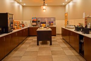 a large kitchen with wooden cabinets and a counter at Clarion Pointe Downtown Gatlinburg in Gatlinburg