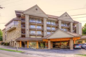 a large building on the corner of a street at Clarion Pointe Downtown Gatlinburg in Gatlinburg