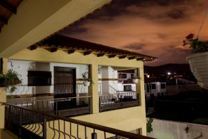 a view of a balcony of a house at night at Hotel Villa Sofia in Nobsa