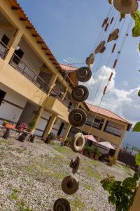 a house with a bunch of tires hanging from it at Hotel Villa Sofia in Nobsa