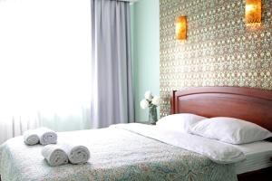 Кровать или кровати в номере Inn Home Apartments - Ocean Plaza area