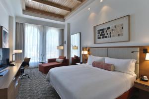 a hotel room with a large bed and a desk at Hotel Real Intercontinental Tegucigalpa, an IHG Hotel in Tegucigalpa