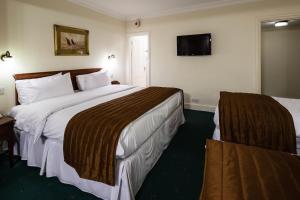 Ein Bett oder Betten in einem Zimmer der Unterkunft Best Western Swiss Cottage Hotel
