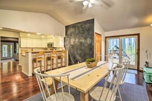 a kitchen and dining room with a wooden table and chairs at Family Escape - Near Little Traverse Wheelway in Harbor Springs