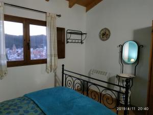 Ένα ή περισσότερα κρεβάτια σε δωμάτιο στο LES ERES DE GÁTOVA-Diente de León