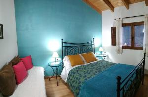 Ένα ή περισσότερα κρεβάτια σε δωμάτιο στο LES ERES DE GÁTOVA-Diente de León