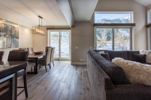 a living room with a couch and a dining room at Snowcreek #754 - Phase V in Mammoth Lakes