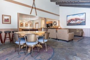 a kitchen and living room with a table and chairs at Chamonix # 62 in Mammoth Lakes