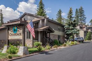a house with an american flag in front of it at Chamonix # 62 in Mammoth Lakes