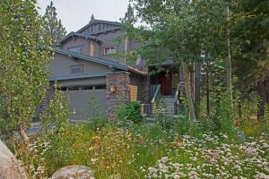 a house with a garden in front of it at Timbers # 1033 in Mammoth Lakes