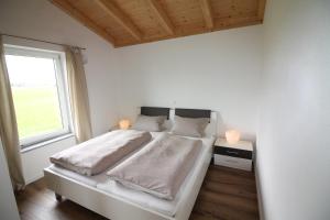 Ein Bett oder Betten in einem Zimmer der Unterkunft Ferienwohnung Stocker