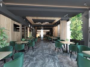 a rendering of a restaurant with tables and green chairs at Zbruch Palace Hotel in Volochysk