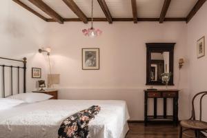 A bed or beds in a room at The Quintessential Cretan Villa