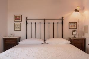 A bed or beds in a room at The Quintessential Cretan Villa