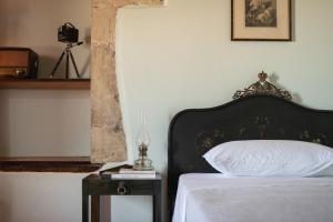 A bed or beds in a room at The Quintessential Cretan Villa
