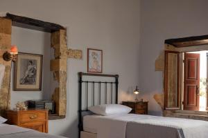 A bed or beds in a room at The Quintessential Cretan Villa