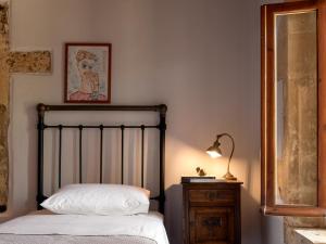 A bed or beds in a room at The Quintessential Cretan Villa