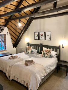 two large beds in a bedroom with a attic at 10 Mount Champagne in Champagne Valley