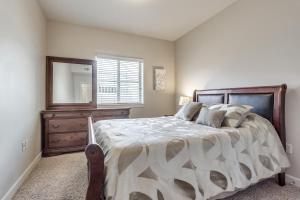 a bedroom with a large bed and a dresser at Downtown Condo Near Convention Center (Disability Access) in Salt Lake City