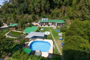 an aerial view of a house with a swimming pool at Quinta Das Murtas B&B in Sintra