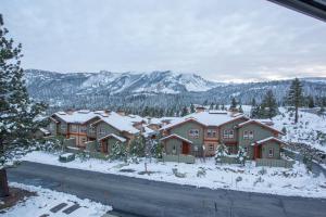 a group of houses with snow on the ground at Juniper Springs Lodge # 426 in Mammoth Lakes