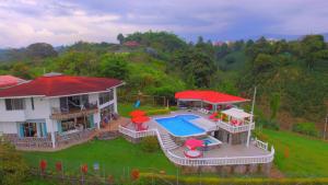 an aerial view of a house with a swimming pool at Castillo Del Toro in Armenia
