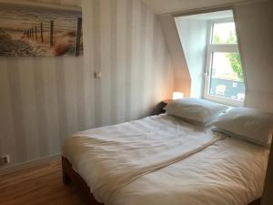 Postel nebo postele na pokoji v ubytování In de Gele Hoed mooie appartementen met fantastisch uitzicht