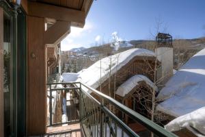 a balcony of a house covered in snow at Villa Montane by East West Hospitality in Beaver Creek