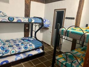 a room with two bunk beds and a doorway at Cabaña hotel conde in Doradal