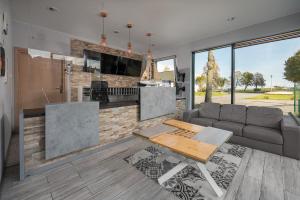 a living room with a couch and a table at Dom Żeglarza in Puck