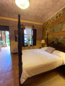 Postel nebo postele na pokoji v ubytování Hotel Palacio de Doña Beatriz