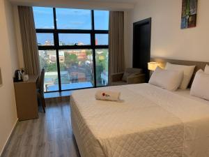 Ліжко або ліжка в номері Hotel Sun