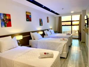Ліжко або ліжка в номері Hotel Sun
