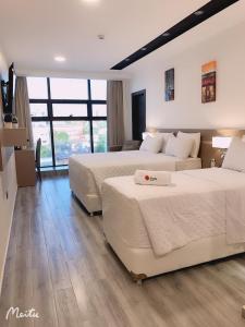 Ліжко або ліжка в номері Hotel Sun