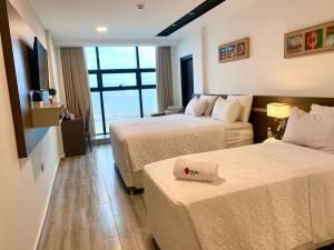 Ліжко або ліжка в номері Hotel Sun