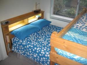 En eller flere senge i et værelse på Blairgowrie Relaxation