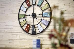 a clock on the side of a brick wall at Best Western Hotel Rosenau in Bad Nauheim