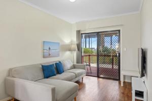 
a living room filled with furniture and a window at Discovery Parks - Adelaide Beachfront in Adelaide
