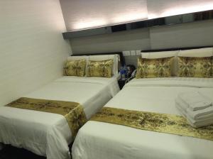 Postel nebo postele na pokoji v ubytování California Hotel